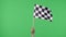 Female hand holding and waving checkered race flag in slow motion against green screen background. Victory, achievement