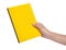 Female hand holding a yellow book