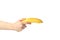 Female hand holds banana, isolated on background