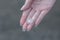 Female hand holds hailstone. Summer hail in the hand of a woman. Large hailstones in the hand of man. Hail in a hand