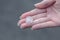 Female hand holds hailstone. Summer hail in the hand of a woman. Large hailstones in the hand of man. Hail in a hand
