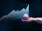 A female hand holds a pink ceramic piggy bank against the background of a growing holographic graph. Income growth concept, high