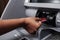 Female Hand Inserting Credit Card in ATM Machine To Transfer Money or Withdraw Cash. Close Up. ATM Transaction