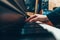 Female hand on the keys of a piano in a recording studio. Record a music track.