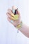 Female hand with long nails and multi-colored bottle manicure with nail polish