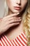 Female hand with manicure. beautiful blonde hair