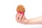Female hand with a manicure holds oatmeal cookies with cereals over white background
