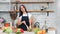 Female hand mixing fresh organic vegetable in bowl cooking vegetarian salad close-up