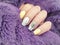 female hand nail beautiful manicure, sweater modern stylish