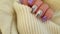 Female hand nails beautiful  creative   manicure sweater