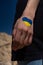 female hand painted in Ukraine flag colors with heart shape