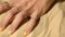 Female hand with a perfect yellow elegant manicure with nail art