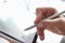 Female hand puts electronic signature in tablet with stylus