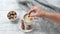 Female hand puts piece of brown sugar in mug with coffee. Cozy autumn composition. Hygge concept