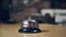 Female hand rings the silver bell on the table. Ring the bell in the restaurant. The bell in the restaurant on the table