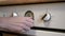 A Female Hand Sets the Time, Mode, Cooking Temperature on a Modern Oven, Stove