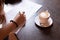 Female hand sign model release document in cafe soft focus concept picture with wooden table and cup coffee