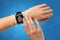 Female hand with smartwatch and app icons