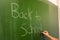 Female Hand Teacher Writing on Green Chalkboard Professor University White Chalk College Education Lesson Back to School