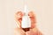 Female hand used medical nasal spray