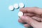 Female hand white circle pill. Medications. Concept medicine