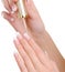 Female hands applying nail vanish on fingernail