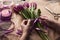 Female hands arranging tulips bouquet