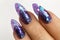 Female hands with beautiful colorful hybrid nails and professional manicure.