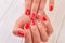 Female hands with beautiful designed manicure.