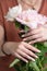 female hands with a beautiful peach manicure design, color 2024, pastel colors, delicate spring dewy peonies
