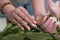 female hands with a beautiful peach manicure design, color 2024, pastel colors, delicate spring dewy peonies