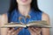 In female hands, book sheets are folded in shape of heart closeup