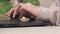 Female hands of a business woman working on computer. Student girl typing text on laptop keyboard. Woman sitting at home