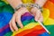 Female hands chained against the background of the LGBT flag. The concept of  the fight for tolerance and equal treatment of