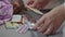 Female hands choosing medicine for treatment