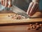 Female hands chopping almonds