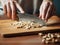 Female hands chopping cashew