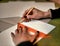 Female hands close-up, with blank white paper sheet, pencil and triangle ruler. education and creativity concept. template for