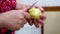 Female hands closeup. Knife peeling potatoes