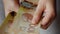 Female hands counting Canadian Dollar bills, close-up.