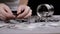 Female Hands Counting Coins that Spilled Out of Glass Piggy Bank on Table. 4K