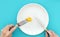 Female hands with cutlery and empty plate