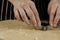 Female hands cutting star gingerbread cookies from the rolled dough