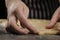 Female hands cutting star gingerbread cookies from the rolled dough