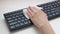 Female hands disinfect a computer keyboard