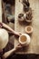 Female hands examining ceramic bowl at workshop