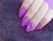 Female hands finger polish , manicure creative paint fur glamour winter beautiful