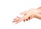 Female hands with french classic manicure. Woman rubs her hands, white background, closeup. Well groomed skin