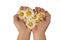 In female hands fresh flowers of white chamomile on a white background, the concept on the theme of female love, maternal care.