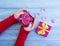 female hands gift box, flower rose elegance on wooden background